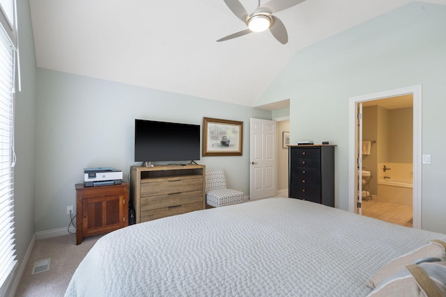 3314 Winged Foot Dr, Nixa, MO 65714 - carpeted bedroom featuring vaulted ceiling, multiple windows, ensuite bath, and a ceiling fan