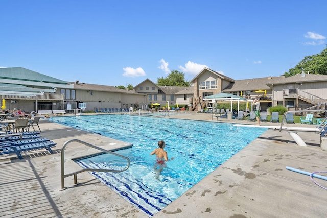 3314 Winged Foot Dr, Nixa, MO 65714 - community pool featuring a patio and a residential view