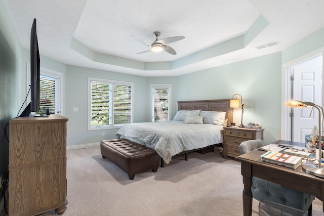 3314 Winged Foot Dr, Nixa, MO 65714 - bedroom featuring a raised ceiling, light carpet, and ceiling fan