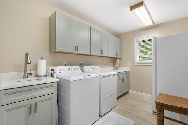 3314 Winged Foot Dr, Nixa, MO 65714 - washroom with cabinet space, separate washer and dryer, and light wood-style floors