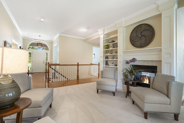 3314 Winged Foot Dr, Nixa, MO 65714 - living area featuring ornamental molding, recessed lighting, an upstairs landing, a tile fireplace, and carpet floors