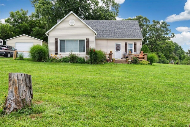 1188 Emerald Rd, Spokane, MO 65754 - view of front facade featuring a detached garage, a front lawn, roof with shingles, and a deck