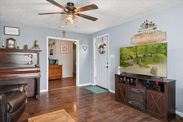 1188 Emerald Rd, Spokane, MO 65754 - entrance foyer featuring a ceiling fan, dark wood-type flooring, and a textured ceiling