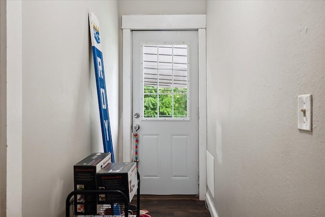 1188 Emerald Rd, Spokane, MO 65754 - doorway with dark wood finished floors and baseboards