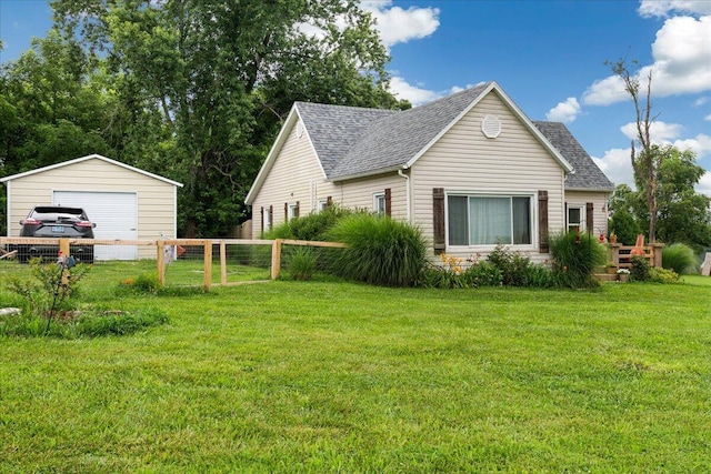 1188 Emerald Rd, Spokane, MO 65754 - view of home's exterior with a detached garage, roof with shingles, and an outdoor structure