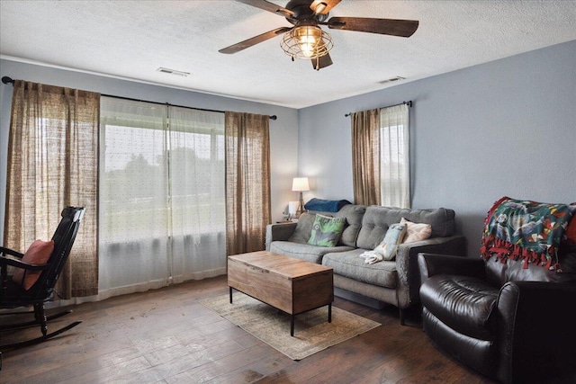 1188 Emerald Rd, Spokane, MO 65754 - living room with a ceiling fan, hardwood / wood-style floors, and a textured ceiling