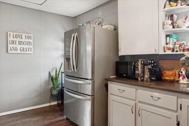 1188 Emerald Rd, Spokane, MO 65754 - kitchen with stainless steel fridge with ice dispenser, dark wood-style floors, black microwave, white cabinetry, and dark countertops