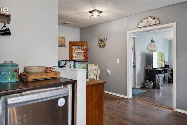 1188 Emerald Rd, Spokane, MO 65754 - kitchen featuring dark wood-style floors, a textured ceiling, and dishwasher