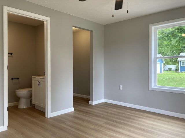 507 W Clouse St, Mountain Grove, MO 65711 - unfurnished bedroom with light wood finished floors and connected bathroom
