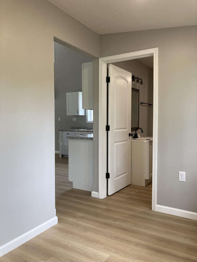507 W Clouse St, Mountain Grove, MO 65711 - hall with light wood finished floors and baseboards