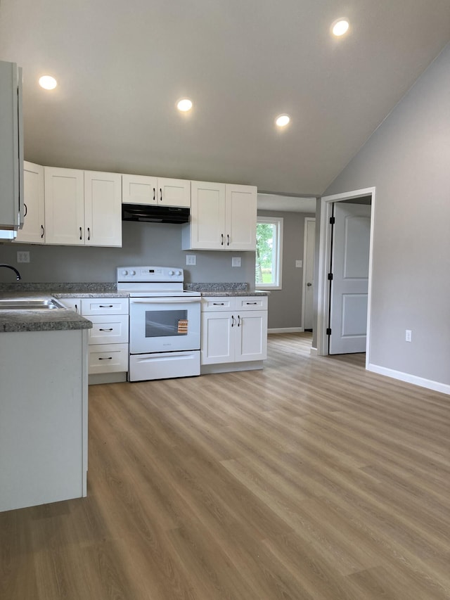 507 W Clouse St, Mountain Grove, MO 65711 - kitchen featuring white electric range, under cabinet range hood, white cabinetry, vaulted ceiling, and recessed lighting
