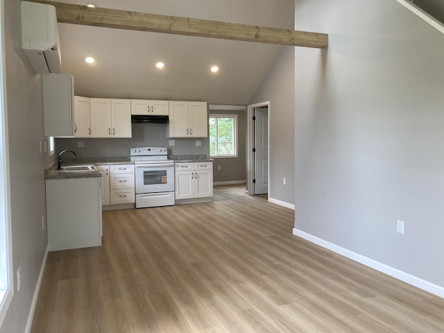 507 W Clouse St, Mountain Grove, MO 65711 - kitchen with electric range, under cabinet range hood, white cabinets, light wood-style floors, and recessed lighting