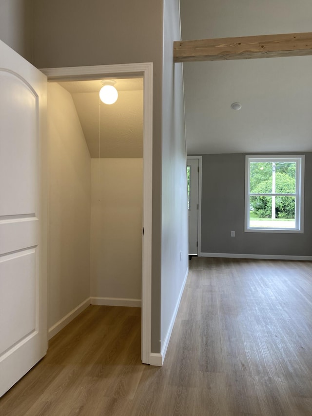 507 W Clouse St, Mountain Grove, MO 65711 - corridor featuring wood finished floors and vaulted ceiling