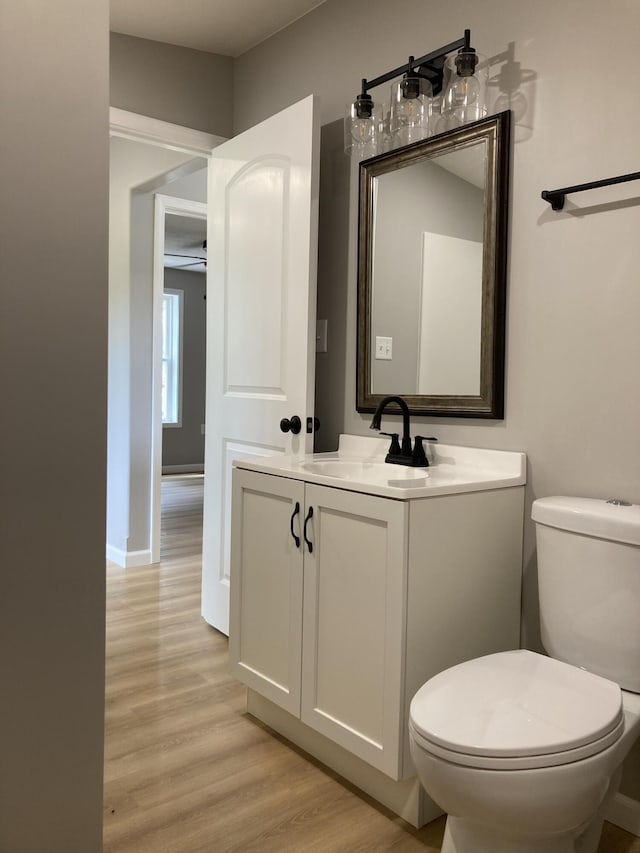 507 W Clouse St, Mountain Grove, MO 65711 - half bathroom with wood finished floors and vanity