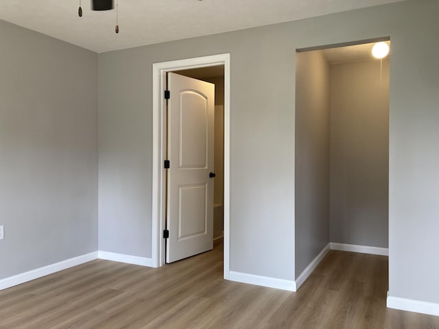 507 W Clouse St, Mountain Grove, MO 65711 - spare room featuring wood finished floors and baseboards
