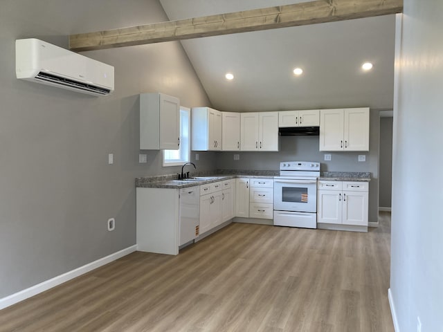 507 W Clouse St, Mountain Grove, MO 65711 - kitchen featuring white appliances, a wall mounted AC, beam ceiling, white cabinets, and light wood-type flooring