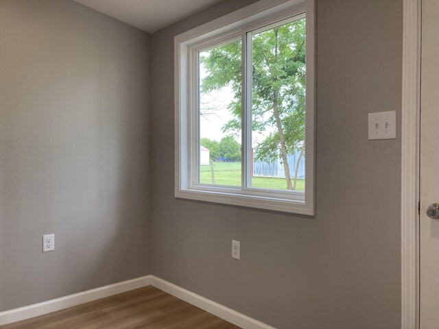 507 W Clouse St, Mountain Grove, MO 65711 - empty room with baseboards and wood finished floors