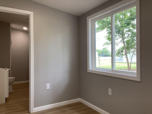 507 W Clouse St, Mountain Grove, MO 65711 - spare room featuring wood finished floors and baseboards