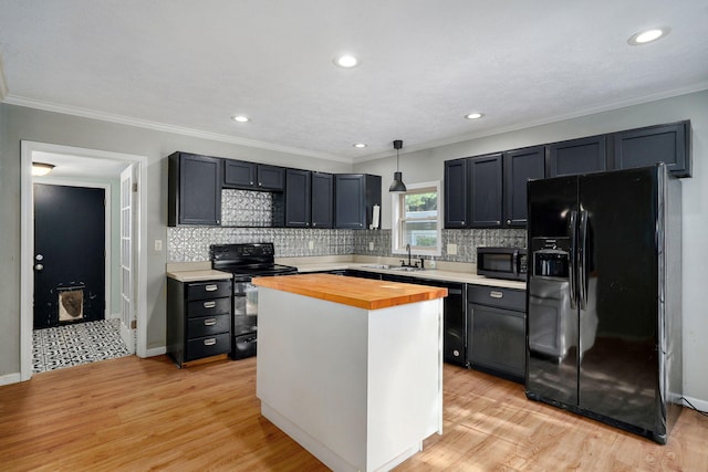 533 N Main St, Republic, MO 65738 - kitchen featuring black appliances, butcher block counters, light wood-style flooring, decorative backsplash, and ornamental molding