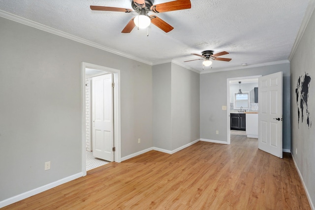 533 N Main St, Republic, MO 65738 - unfurnished living room with a ceiling fan, light wood-type flooring, a textured ceiling, and ornamental molding