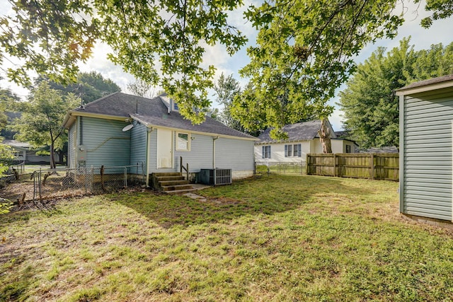 533 N Main St, Republic, MO 65738 - rear view of house with entry steps and a fenced backyard
