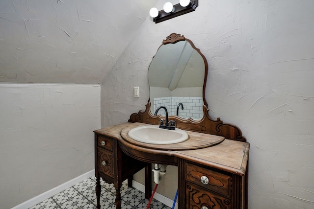 533 N Main St, Republic, MO 65738 - bathroom featuring lofted ceiling, vanity, and tile patterned floors