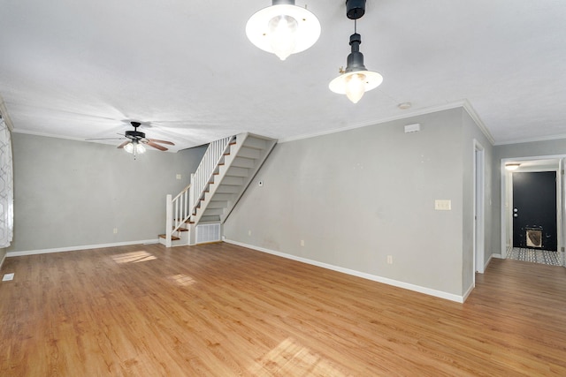 533 N Main St, Republic, MO 65738 - unfurnished living room featuring a ceiling fan, stairway, light wood finished floors, and crown molding
