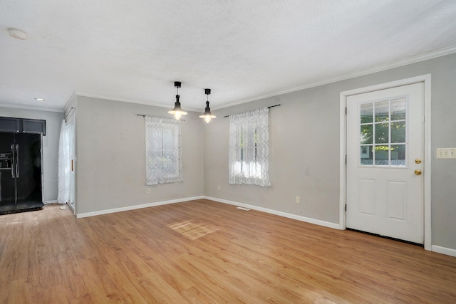 533 N Main St, Republic, MO 65738 - unfurnished living room featuring ornamental molding and light wood-style floors