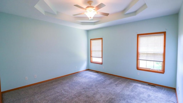 5546 S Aspen Dr, Battlefield, MO 65619 - empty room featuring plenty of natural light, carpet, a raised ceiling, and a ceiling fan
