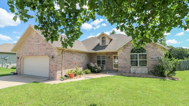 5546 S Aspen Dr, Battlefield, MO 65619 - view of front facade featuring brick siding, an attached garage, driveway, and a shingled roof
