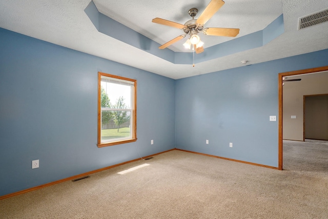 844 S Natalie Ave, Springfield, MO 65802 - empty room featuring carpet, a tray ceiling, ceiling fan, a smoke detector, and a textured ceiling