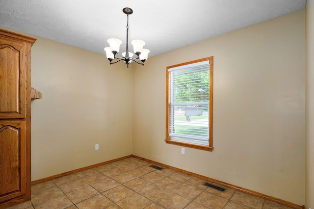 844 S Natalie Ave, Springfield, MO 65802 - spare room with a chandelier and light tile patterned floors