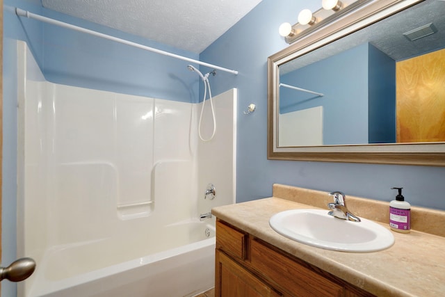 844 S Natalie Ave, Springfield, MO 65802 - bathroom featuring tub / shower combination, vanity, and a textured ceiling