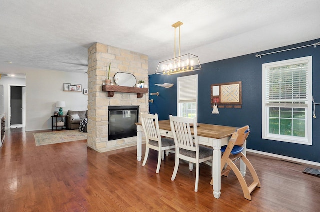 5055 E Cherry Pl, Springfield, MO 65809 - dining room with a stone fireplace and wood finished floors