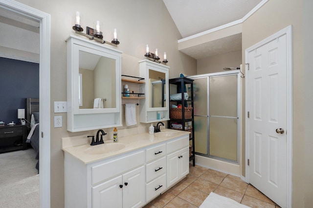 5055 E Cherry Pl, Springfield, MO 65809 - bathroom with lofted ceiling, a shower stall, double vanity, and tile patterned floors