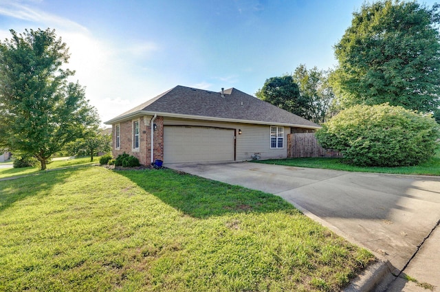 5055 E Cherry Pl, Springfield, MO 65809 - view of property exterior featuring concrete driveway, a garage, brick siding, and roof with shingles