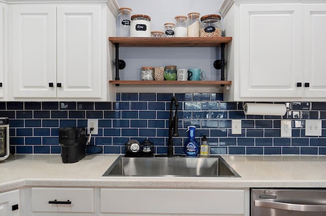 5055 E Cherry Pl, Springfield, MO 65809 - kitchen with stainless steel dishwasher, open shelves, white cabinets, and backsplash