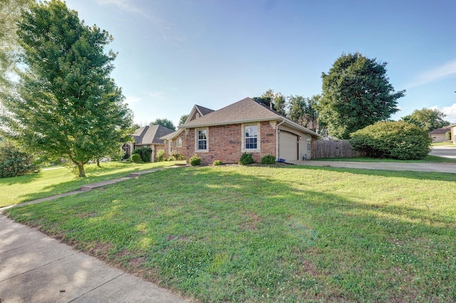 5055 E Cherry Pl, Springfield, MO 65809 - view of front of house featuring driveway, brick siding, and a garage