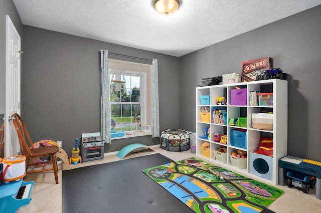 5055 E Cherry Pl, Springfield, MO 65809 - recreation room featuring a textured ceiling and carpet flooring