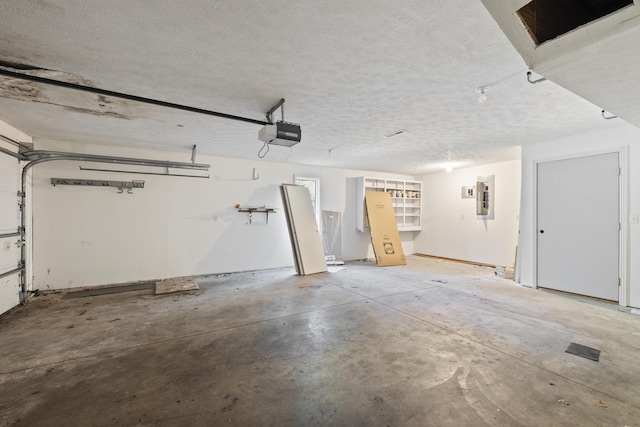 2266 E Barataria St, Springfield, MO 65804 - garage featuring electric panel and a garage door opener