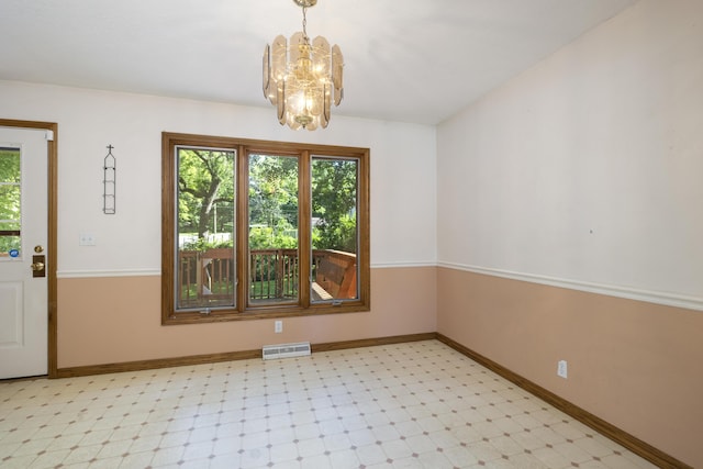 2266 E Barataria St, Springfield, MO 65804 - empty room featuring a chandelier and light flooring
