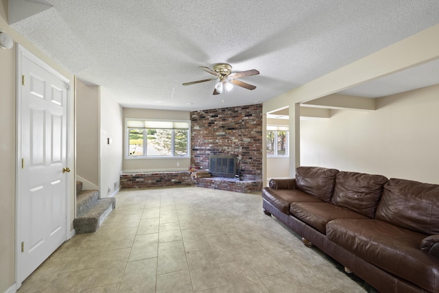 2266 E Barataria St, Springfield, MO 65804 - living area with ceiling fan, stairway, a textured ceiling, and light tile patterned floors