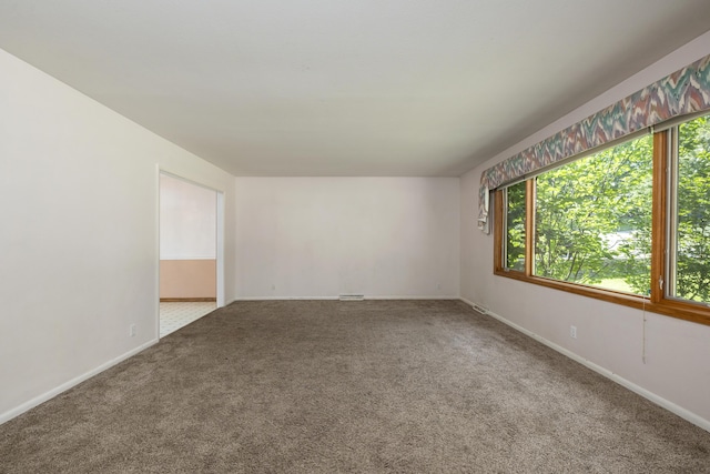 2266 E Barataria St, Springfield, MO 65804 - spare room featuring plenty of natural light and carpet