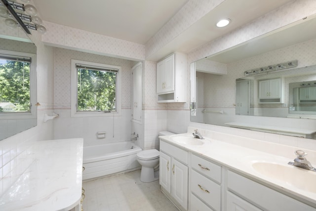 2266 E Barataria St, Springfield, MO 65804 - full bath with wallpapered walls, double vanity, a tub to relax in, tile walls, and tile patterned floors