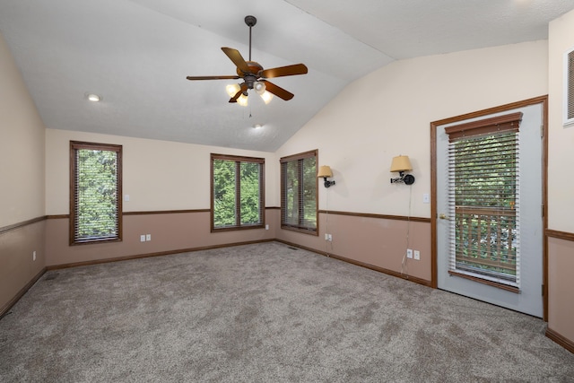 2266 E Barataria St, Springfield, MO 65804 - carpeted spare room featuring vaulted ceiling, a ceiling fan, and plenty of natural light