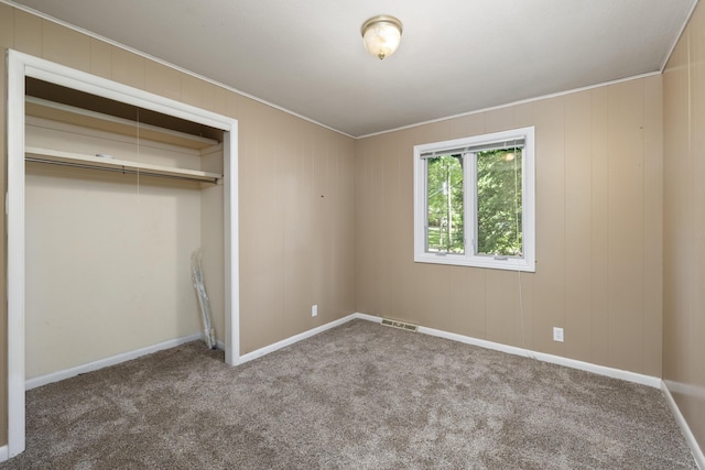 2266 E Barataria St, Springfield, MO 65804 - unfurnished bedroom featuring crown molding, carpet flooring, and a closet