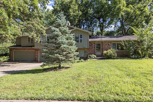 2266 E Barataria St, Springfield, MO 65804 - tri-level home with brick siding, an attached garage, a front yard, and concrete driveway