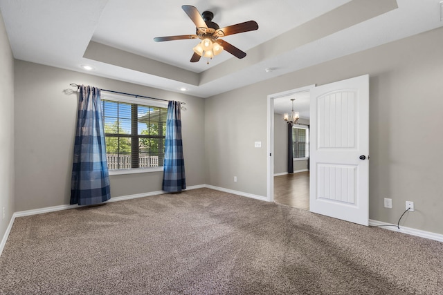 1950 S Trinidad Dr, Ozark, MO 65721 - carpeted empty room featuring a tray ceiling, a chandelier, ceiling fan, and recessed lighting