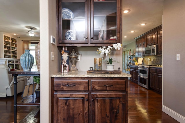 4604 E Kentbrook Dr, Springfield, MO 65802 - bar with appliances with stainless steel finishes, a ceiling fan, decorative backsplash, dark wood-style flooring, and recessed lighting