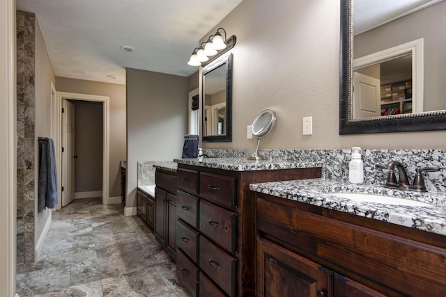 4604 E Kentbrook Dr, Springfield, MO 65802 - bathroom with double vanity and baseboards